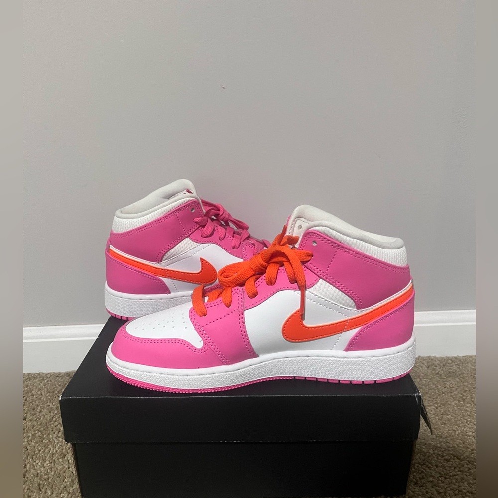 Pink and orange mid top Jordan’s!